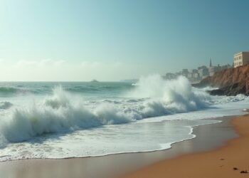 A view of the tumultuous sea and rocky shore in Casablanca, Morocco, during a challenging weather scenario.