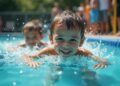 Children swimming under supervision at a public pool, focusing on safety measures