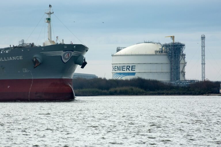 The Amazon Brilliance oil tanker sails past a storage tank at the Cheniere Energy Inc. liquefied natural gas (LNG) terminal in Sabine Pass, Louisiana, U.S., on Thursday, Jan. 14, 2016. Cheniere Energy Inc. said its first cargo of LNG from its new Louisiana export terminal will be delayed by as much as two months because of faulty wiring. Photographer: F. Carter Smith/Bloomberg via Getty Images